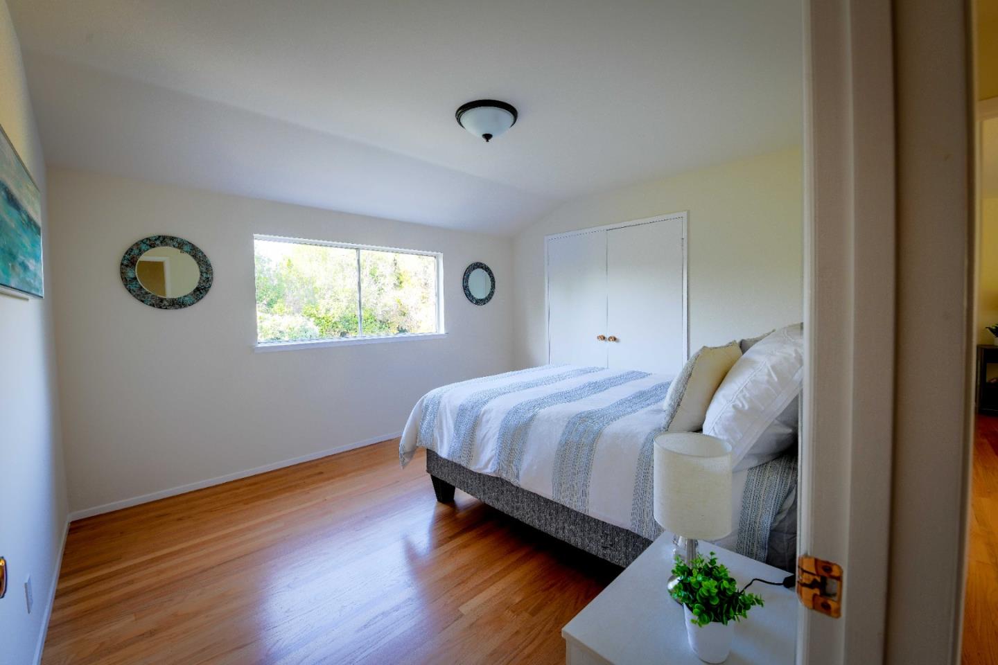 1130 Bruckner Circle Mountain View, CA 94040 - Photo 27 of 41 a bedroom with a bed and a window