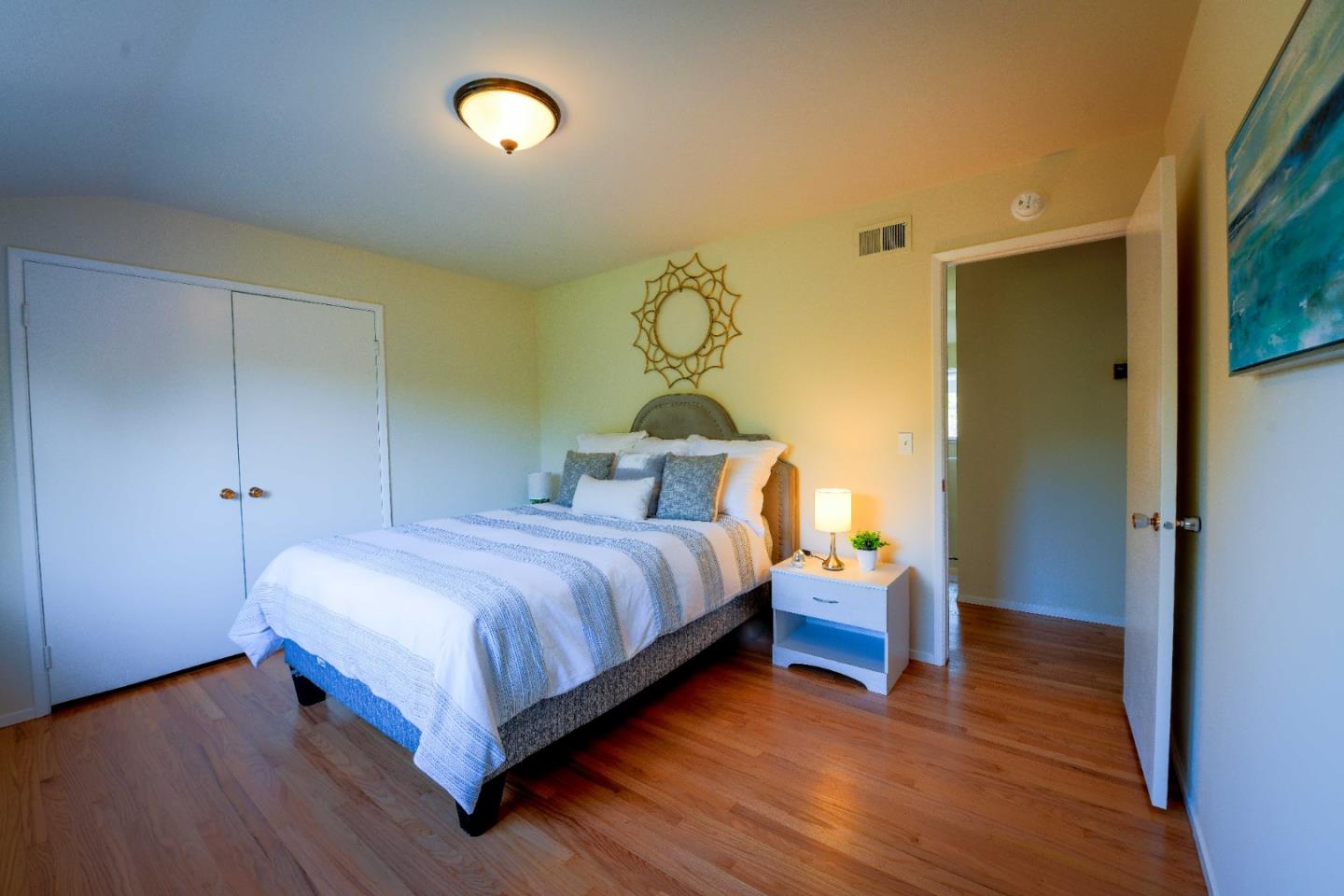 1130 Bruckner Circle Mountain View, CA 94040 - Photo 28 of 41 a bedroom with a bed and wooden floor