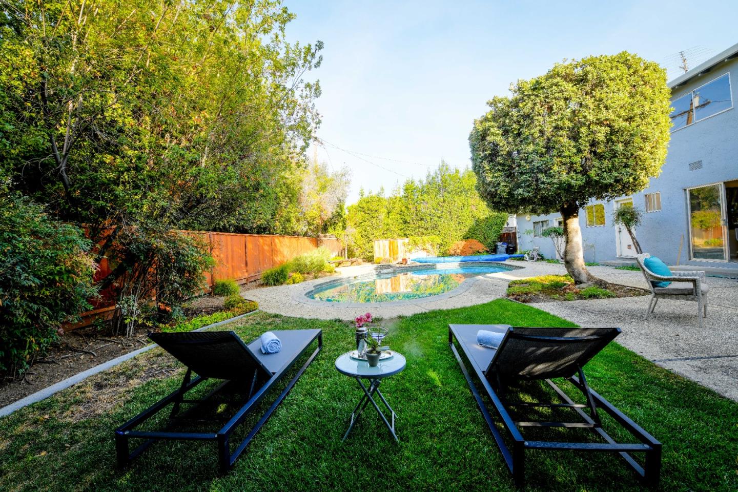 1130 Bruckner Circle Mountain View, CA 94040 - Photo 38 of 41 a view of backyard with swimming pool and outdoor seating