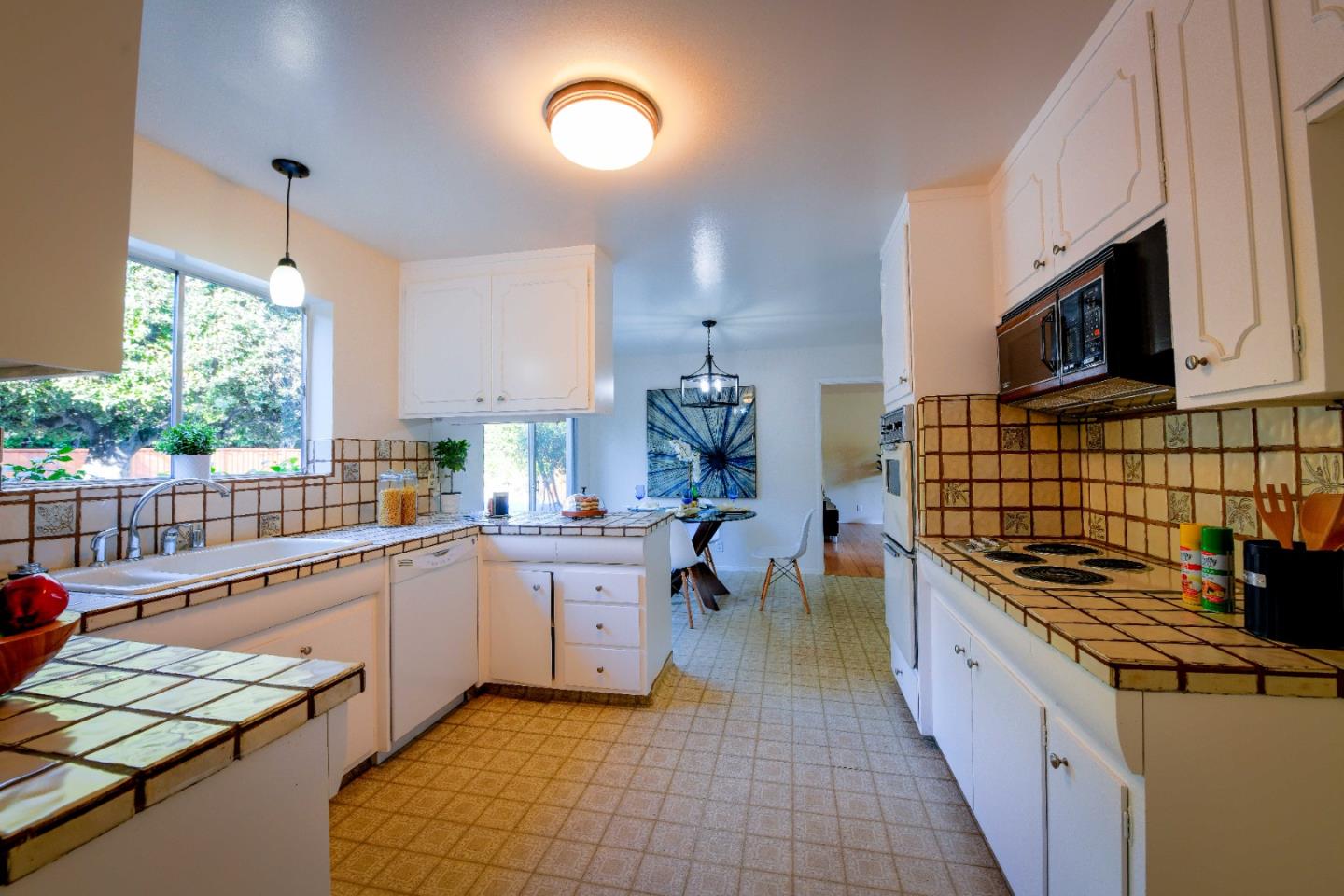 1130 Bruckner Circle Mountain View, CA 94040 - Photo 10 of 41 a kitchen with stainless steel appliances a sink stove top oven and cabinets