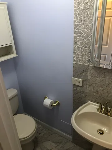 a bathroom with a toilet and a sink