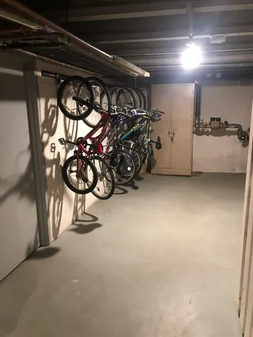 a view of a garage with rack and bicycle