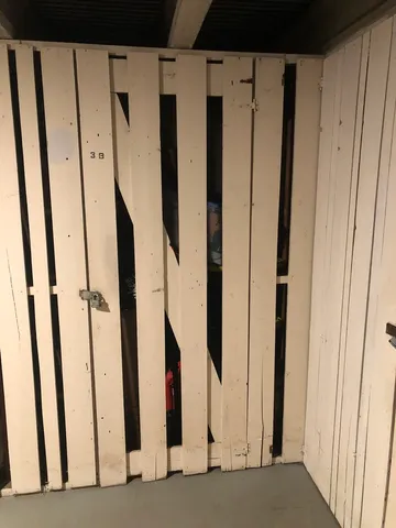 a view of walk in closet with clothes