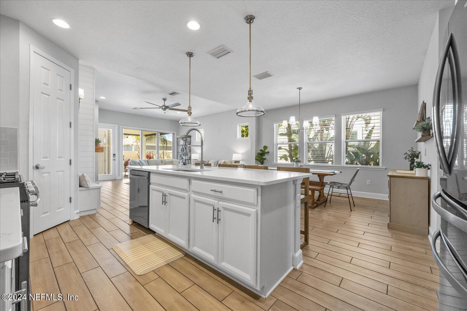 36 Foster Lane Ponte Vedra, FL 32081 - Photo 20 of 59 a large kitchen with lots of counter space a sink appliances and cabinets
