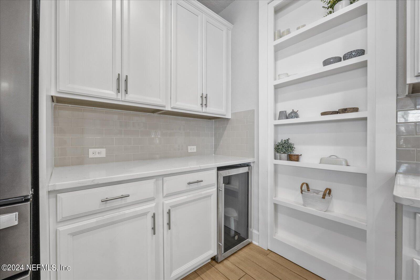 36 Foster Lane Ponte Vedra, FL 32081 - Photo 22 of 59 a kitchen with white cabinets and white appliances