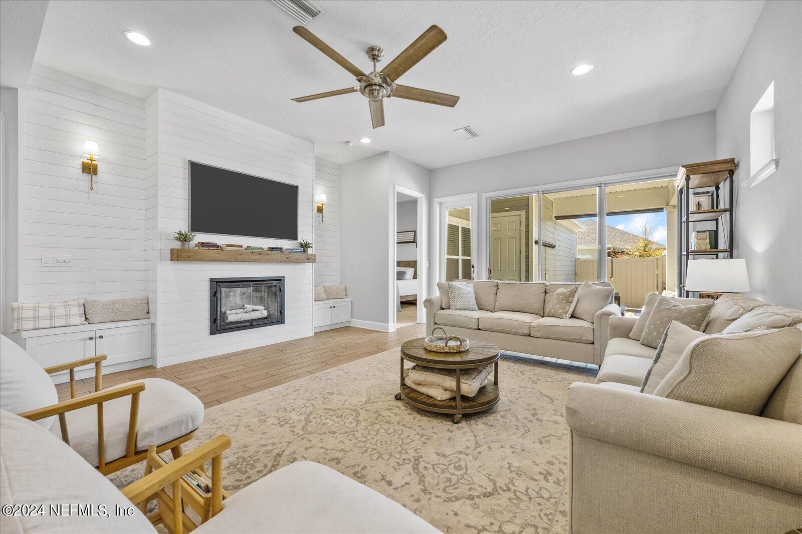 36 Foster Lane Ponte Vedra, FL 32081 - Photo 30 of 59 a living room with furniture a fireplace and a flat screen tv