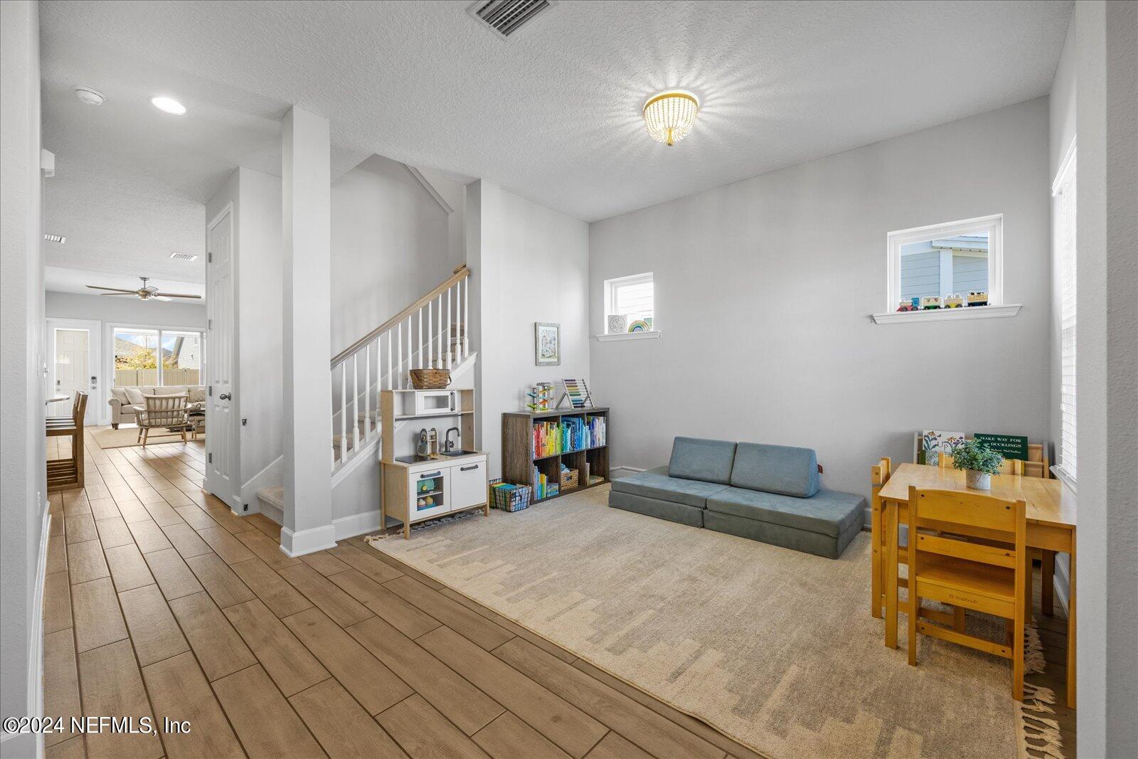 36 Foster Lane Ponte Vedra, FL 32081 - Photo 5 of 59 a living room with furniture and a wooden floor
