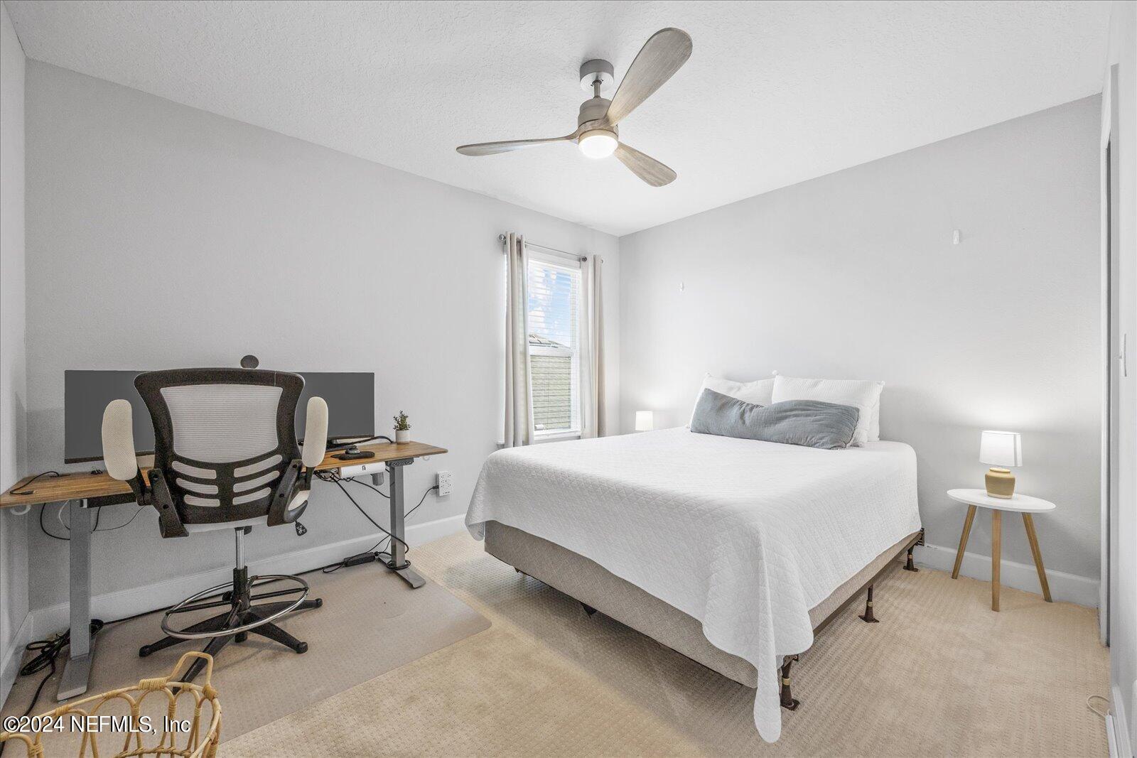 36 Foster Lane Ponte Vedra, FL 32081 - Photo 52 of 59 a bedroom with a bed a chair and a chandelier