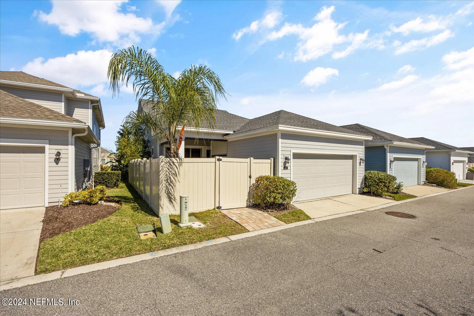 36 Foster Lane Ponte Vedra, FL 32081 - Photo 56 of 59 a front view of a house with a yard and garage