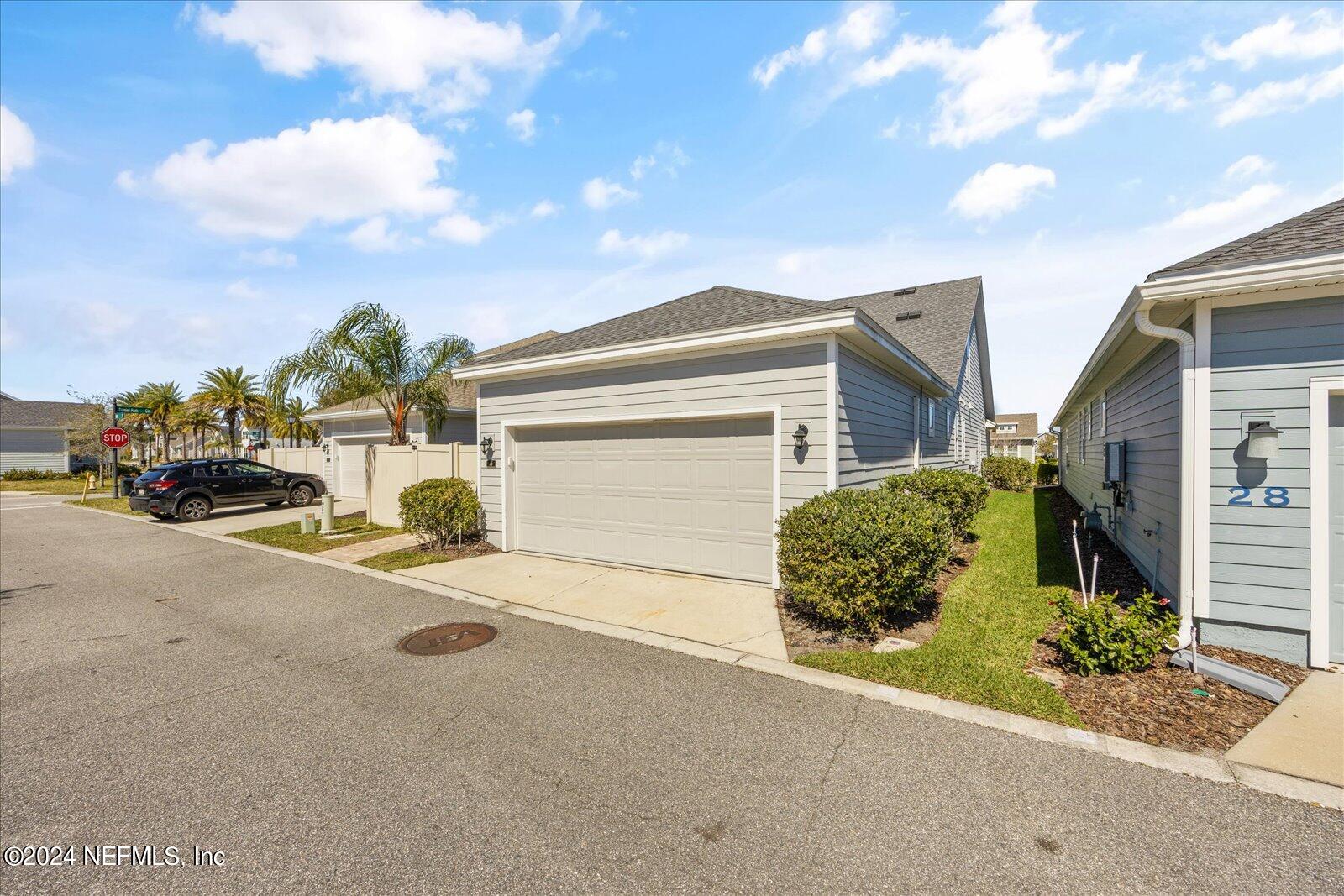 36 Foster Lane Ponte Vedra, FL 32081 - Photo 58 of 59 a front view of a house with a yard and garage