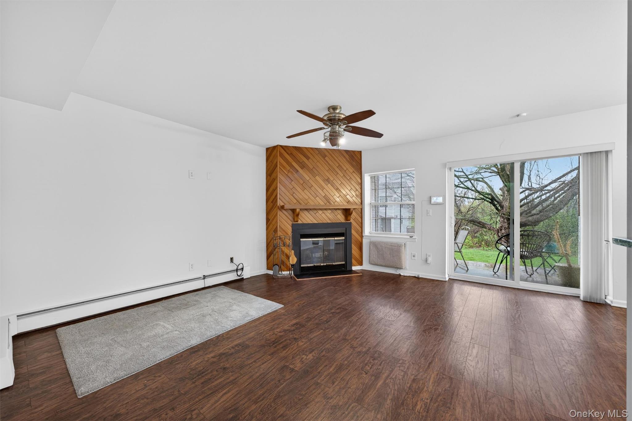 5 Lexington Hills Road, Unit 1 Harriman, NY 10926 - Photo 2 of 29 wooden floor in an empty room with a window