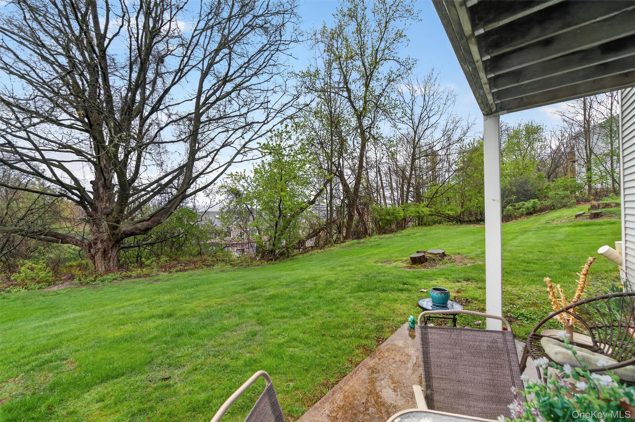 5 Lexington Hills Road, Unit 1 Harriman, NY 10926 - Photo 21 of 29 a view of a backyard with a garden and plants