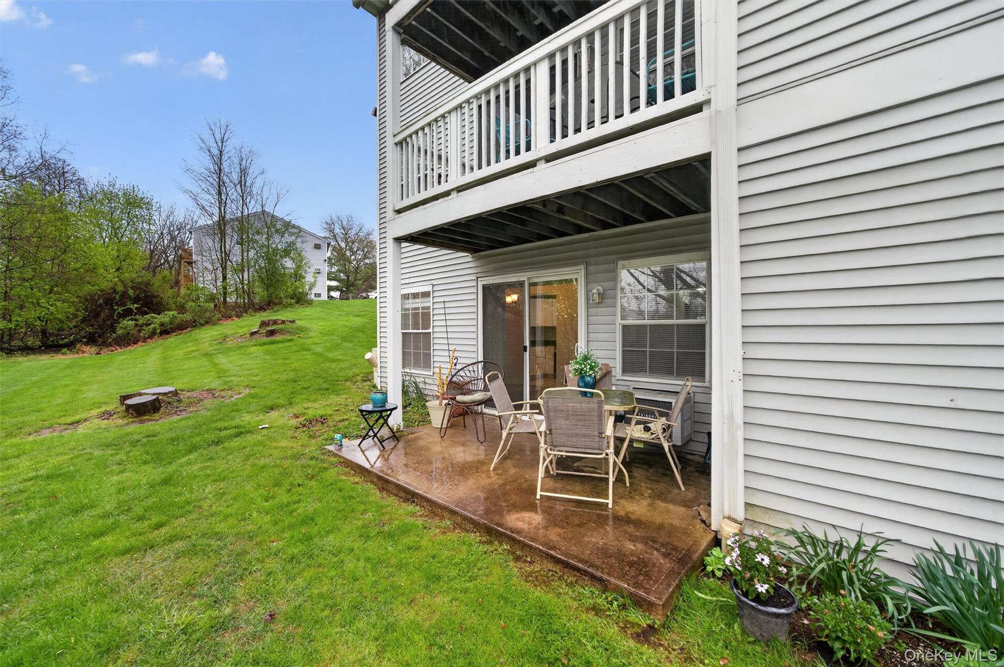 5 Lexington Hills Road, Unit 1 Harriman, NY 10926 - Photo 25 of 29 a view of a house with backyard and sitting area