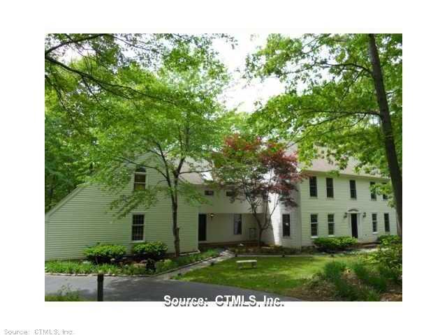 105 Laurel Cliffs Road Guilford, CT 06437 - Photo 1 of 1 a front view of a house with a garden