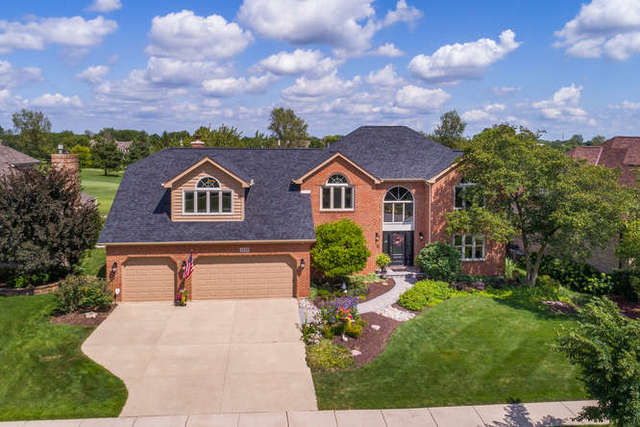 1572 White Eagle Drive Naperville, IL 60564 - Photo 1 of 33 a front view of a house with garden