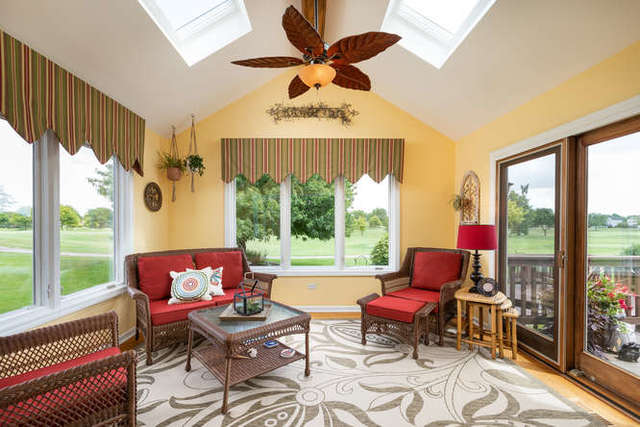 1572 White Eagle Drive Naperville, IL 60564 - Photo 11 of 33 a living room with furniture and a floor to ceiling window