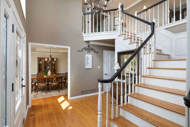1572 White Eagle Drive Naperville, IL 60564 - Photo 13 of 33 a view of staircase with lots of wooden furniture and a next to windows