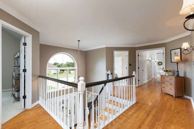 1572 White Eagle Drive Naperville, IL 60564 - Photo 14 of 33 a view of an entryway with wooden floor and windows