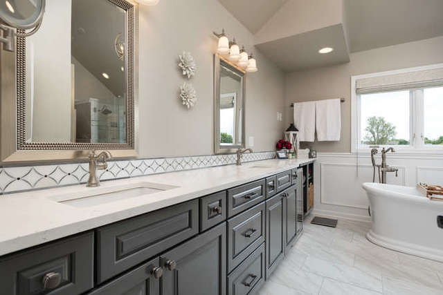 1572 White Eagle Drive Naperville, IL 60564 - Photo 16 of 33 a bathroom with a sink double vanity and a mirror