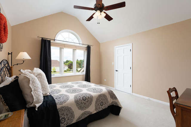 1572 White Eagle Drive Naperville, IL 60564 - Photo 19 of 33 a bedroom with a bed and window
