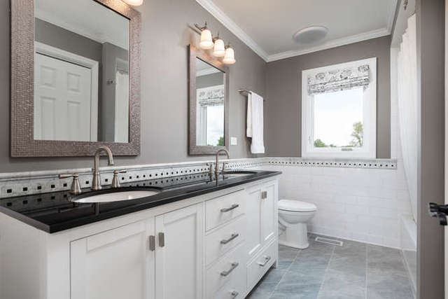 1572 White Eagle Drive Naperville, IL 60564 - Photo 21 of 33 a bathroom with a granite countertop sink and a mirror