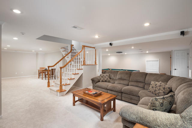 1572 White Eagle Drive Naperville, IL 60564 - Photo 24 of 33 a living room with furniture and a couch