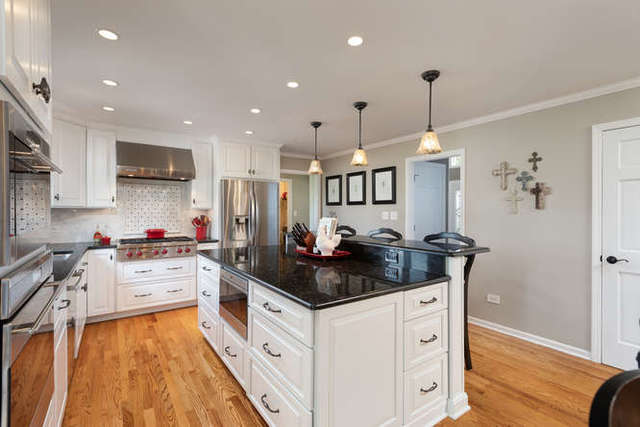 1572 White Eagle Drive Naperville, IL 60564 - Photo 6 of 33 a kitchen with stainless steel appliances granite countertop a stove a sink and a refrigerator
