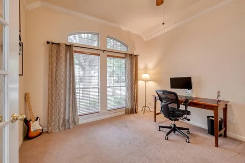 a view of a dining room with furniture wooden floor and chandelier