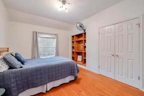 a bedroom with a bed and a table in it
