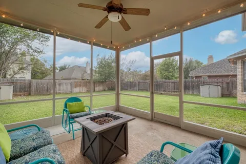 a patio with table and chairs