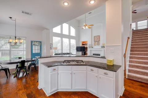 a view of a house with a backyard