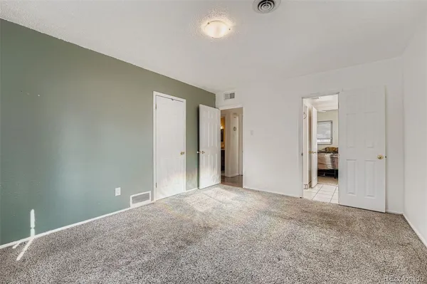 a view of an empty room and window