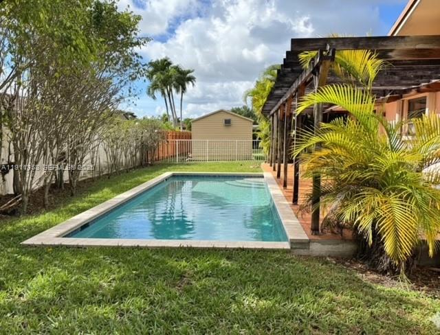 9730 Southwest 5th Street Miami, FL 33174 - Photo 12 of 37 a view of swimming pool with a yard