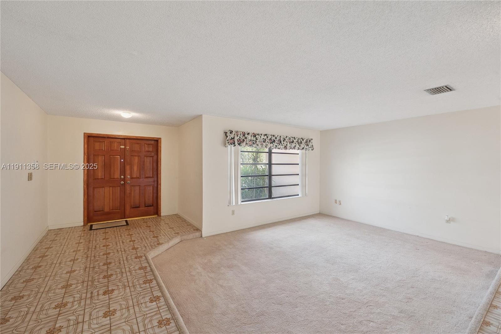9730 Southwest 5th Street Miami, FL 33174 - Photo 17 of 37 a view of an empty room with closet and a window