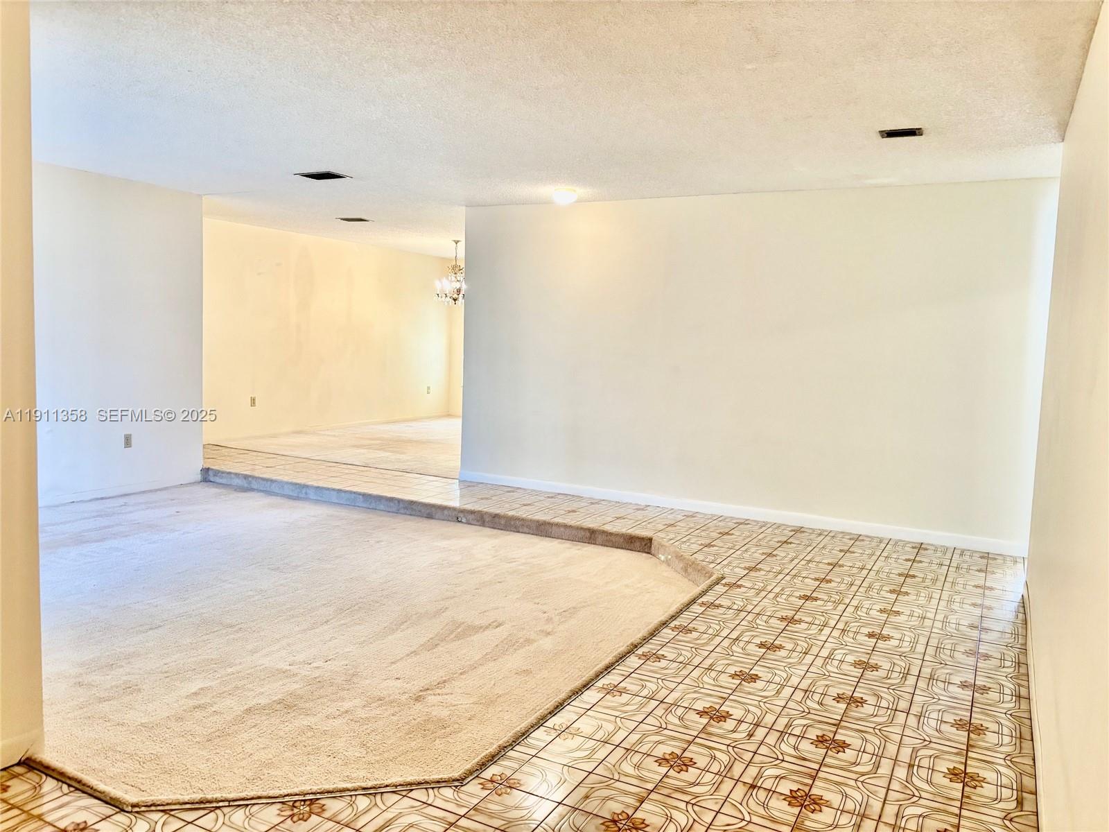 9730 Southwest 5th Street Miami, FL 33174 - Photo 18 of 37 an empty room with a natural light