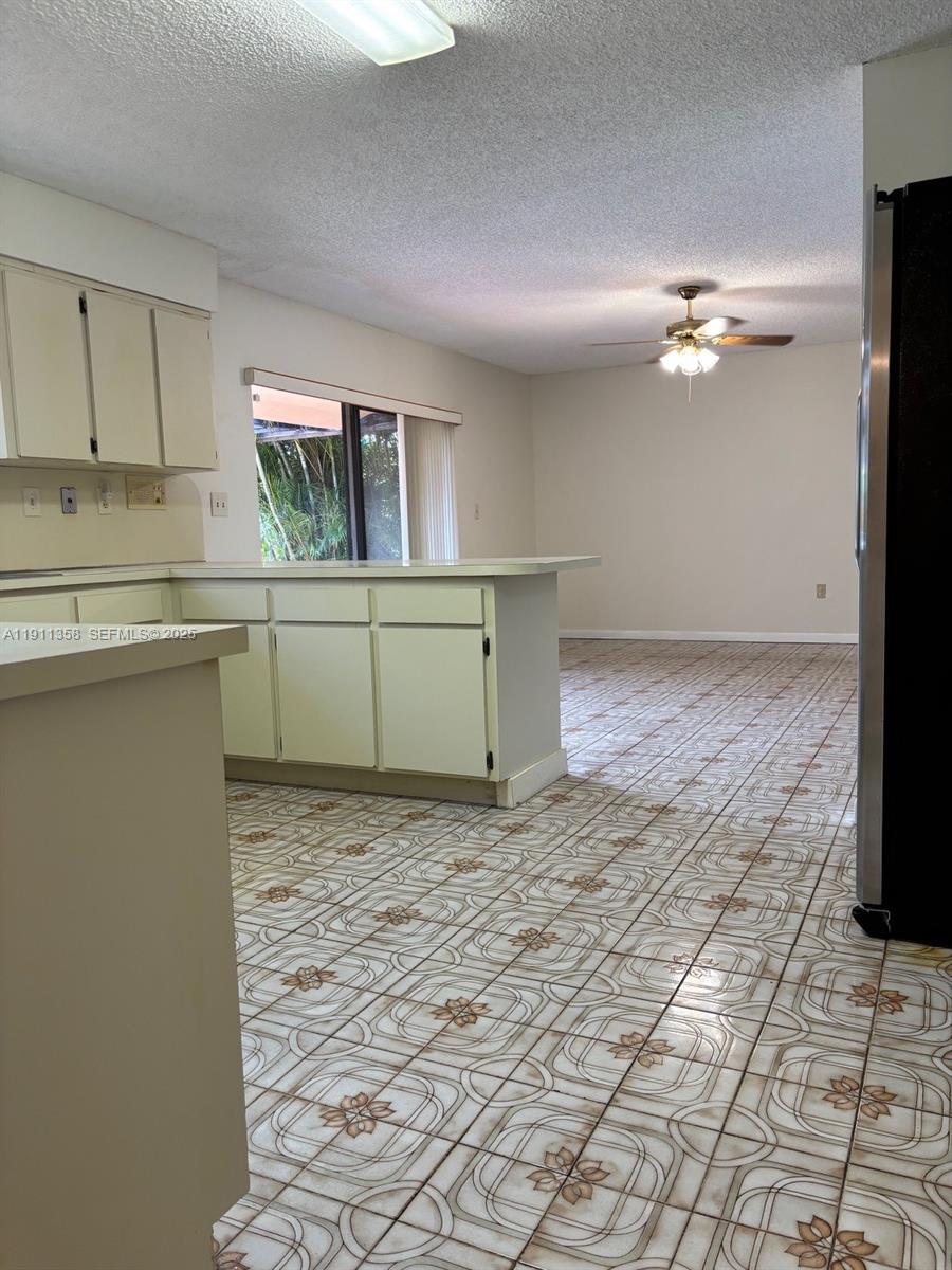 9730 Southwest 5th Street Miami, FL 33174 - Photo 24 of 37 a kitchen with cabinets and window