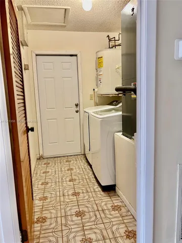 a bathroom with a toilet a sink and a bathtub