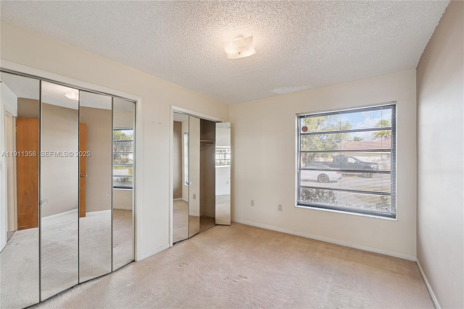 9730 Southwest 5th Street Miami, FL 33174 - Photo 28 of 37 a view of an empty room with a window