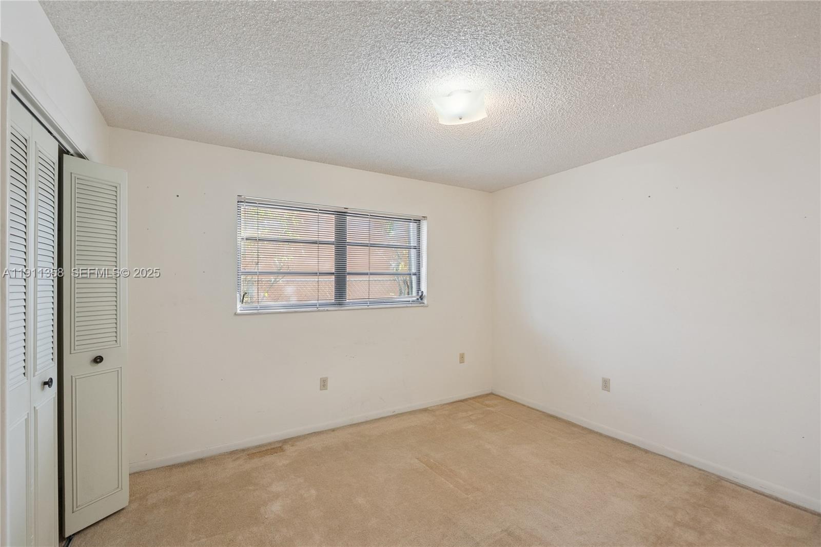 9730 Southwest 5th Street Miami, FL 33174 - Photo 36 of 37 an empty room with windows