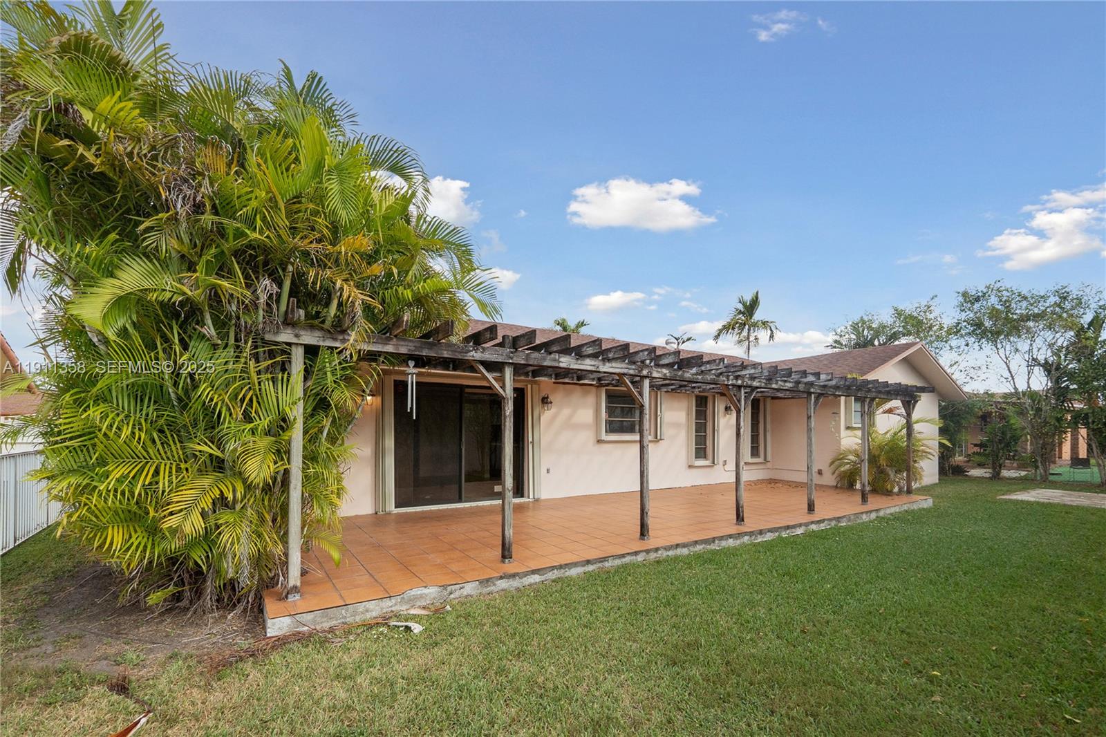 9730 Southwest 5th Street Miami, FL 33174 - Photo 6 of 37 a front view of a house with a garden