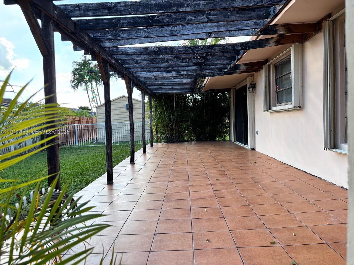 9730 Southwest 5th Street Miami, FL 33174 - Photo 7 of 37 a view of a porch with a backyard