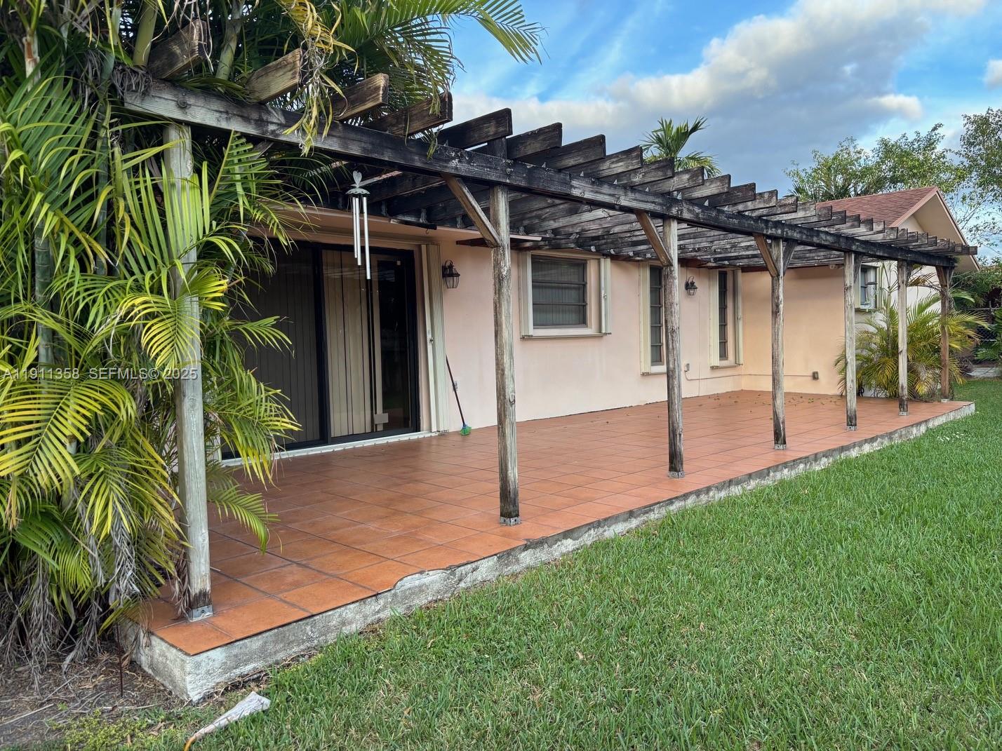 9730 Southwest 5th Street Miami, FL 33174 - Photo 8 of 37 a view of a backyard with a patio
