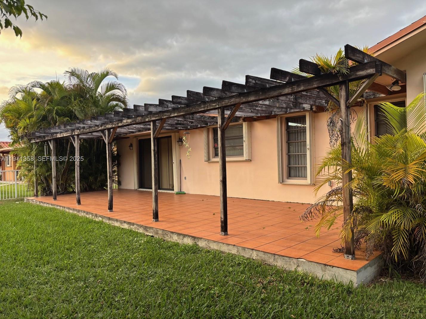 9730 Southwest 5th Street Miami, FL 33174 - Photo 9 of 37 a view of a house with a yard