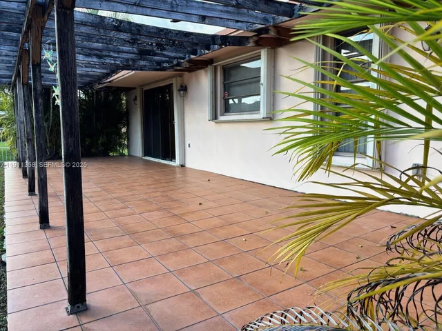 a view of swimming pool with a yard