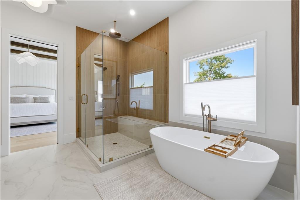 237 Lask Lane Milton, GA 30004 - Photo 40 of 63 a bathroom with a tub a sink and a shower