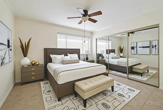 a bedroom with furniture and a chandelier