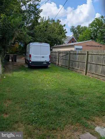 a view of backyard with green space