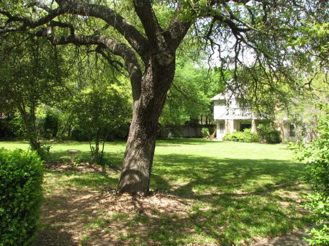 4202 Hudson Bend Road, Unit C Austin, TX 78734 - Photo 1 of 1 a front view of a house with a yard