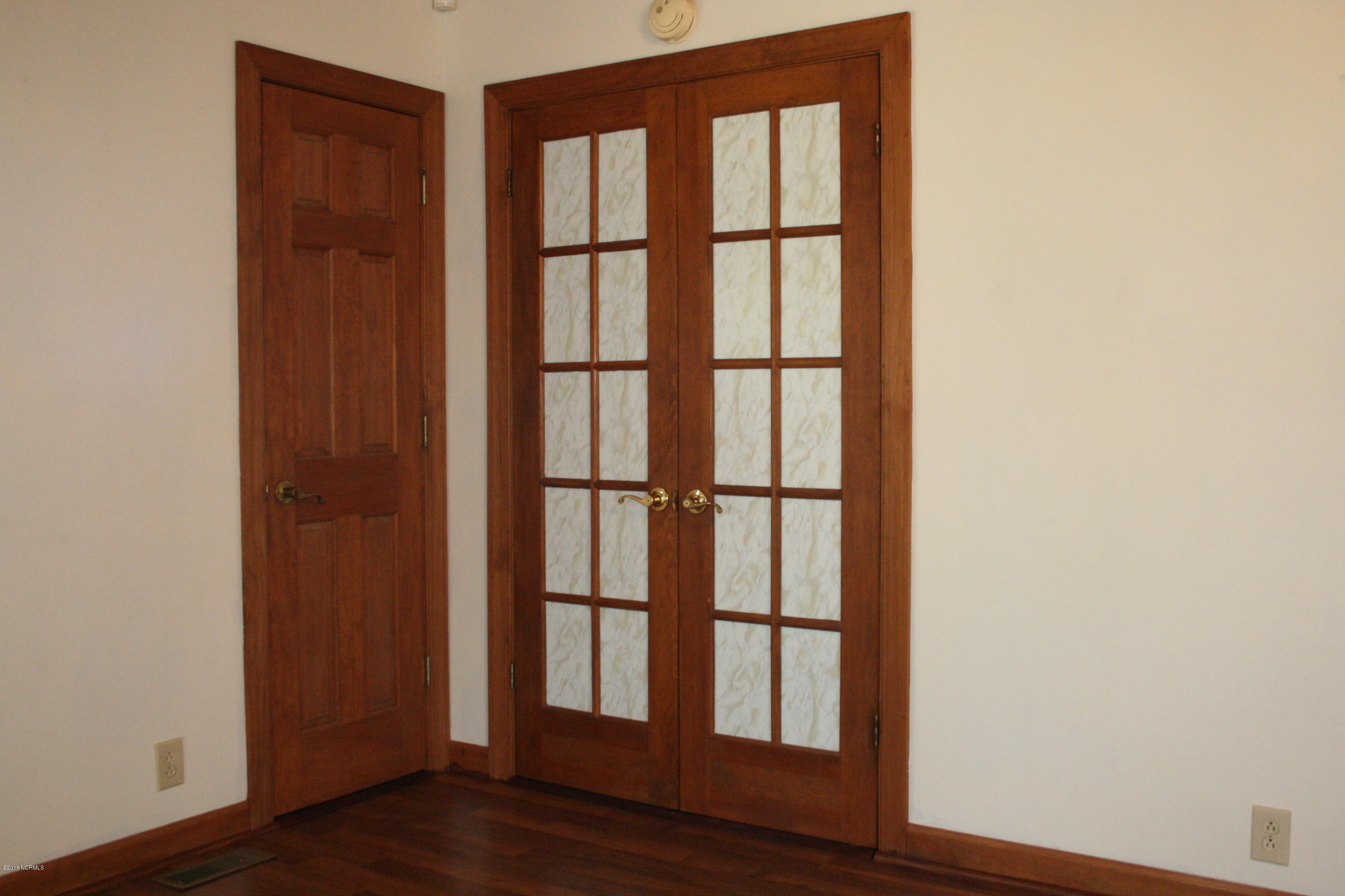 3210 Dover Fort Barnwell Road Dover, NC 28526 - Photo 11 of 39 froasted french doors lead to master