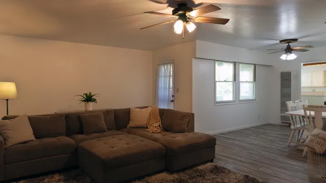 a living room with furniture and a window